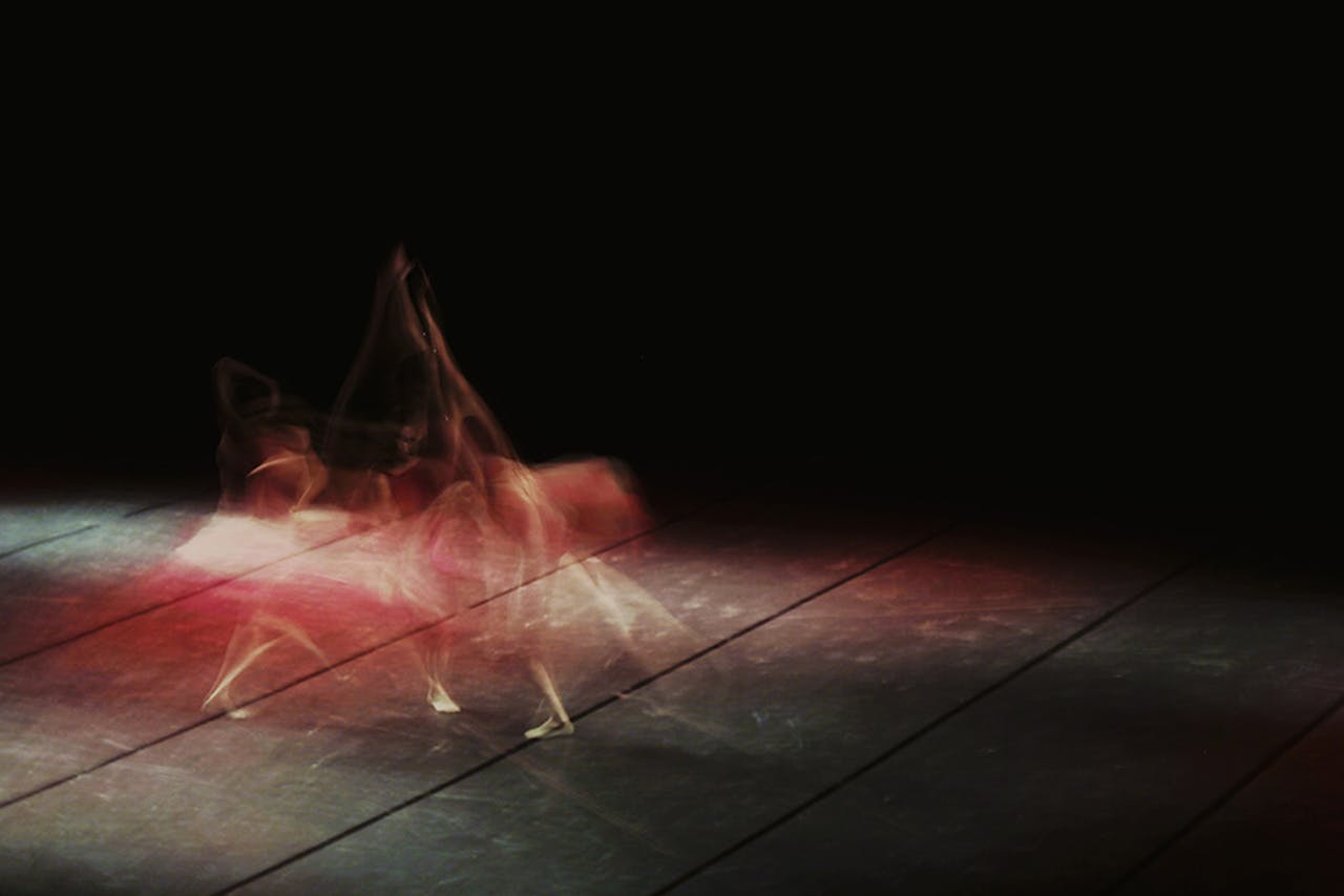 The Art of Drawing Readers In: Your attractive post title goes here Artistic long exposure of a ballet dancer in motion, showcasing dynamic movement on stage.